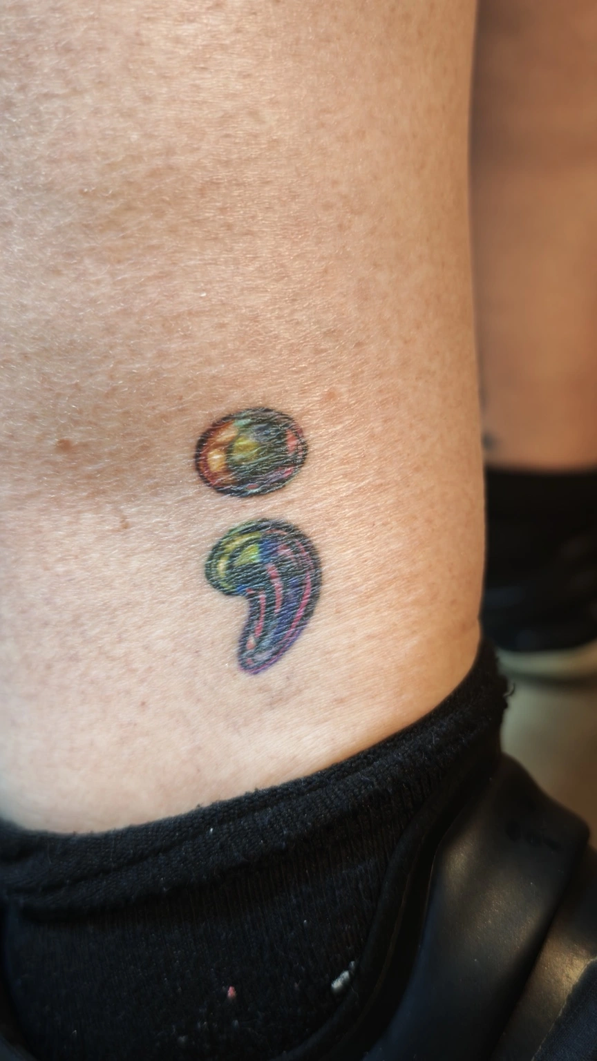Iridescent Semicolon — healed tattoo